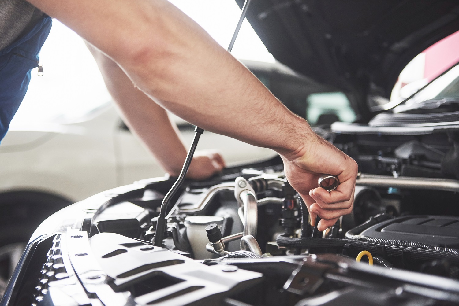 close-up-hands-of-unrecognizable-mechanic-doing-car-service-and-maintenance.jpg